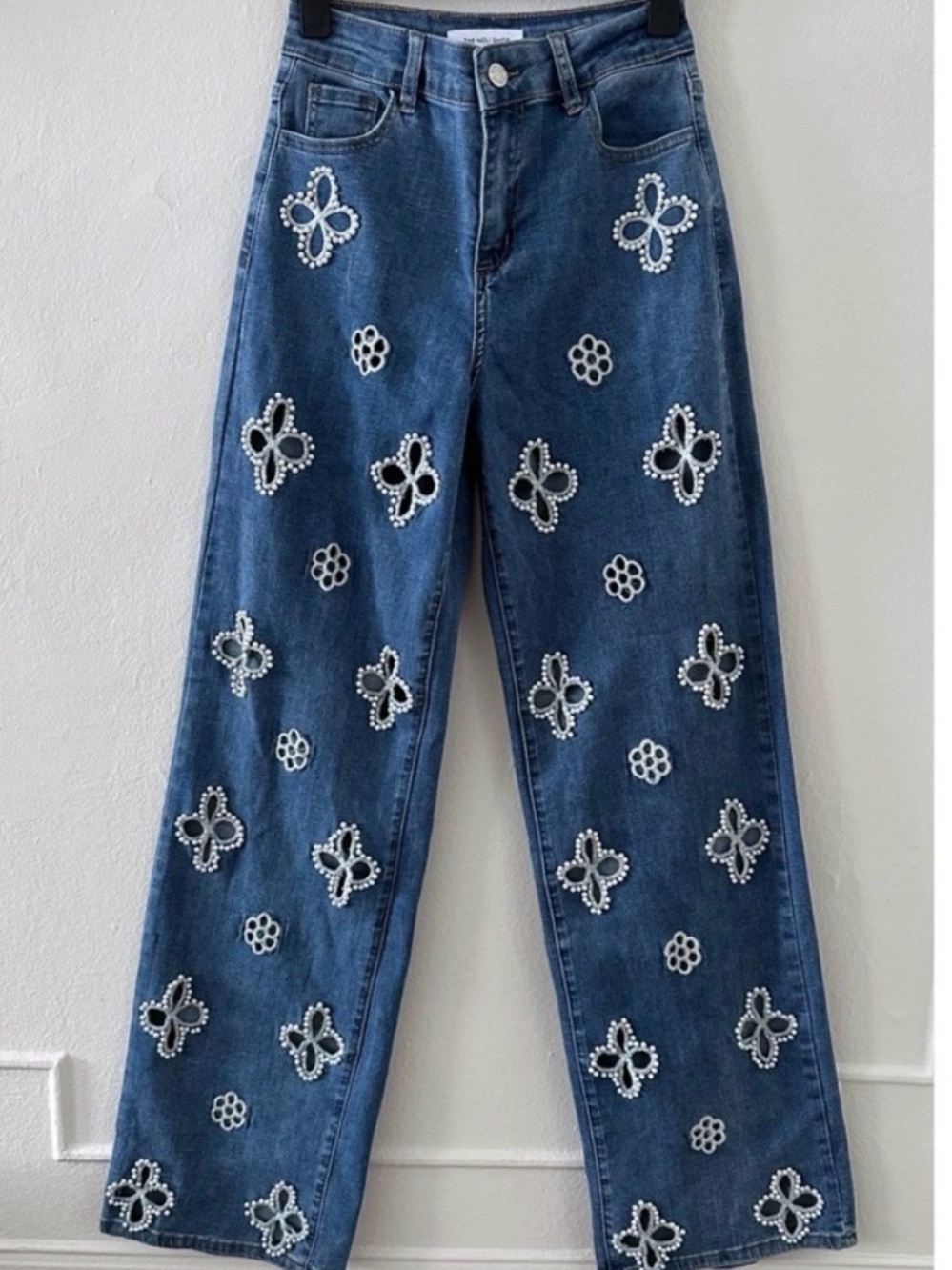 Noli Blue Denim Jeans with White Embellished Floral Appliqués. 25